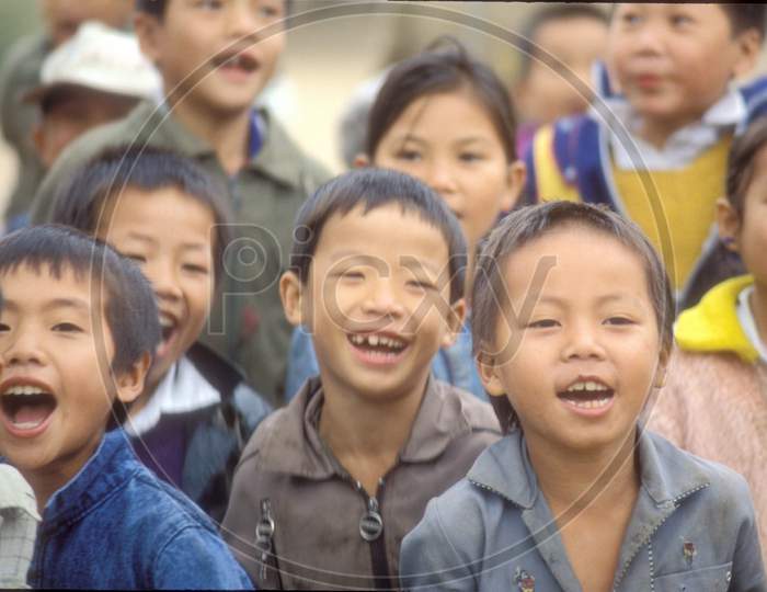 Group Of Chinese Children In The Street