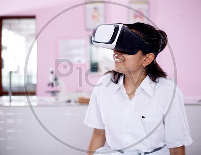 Girl wearing VR  virtual reality goggles interaction headset ,