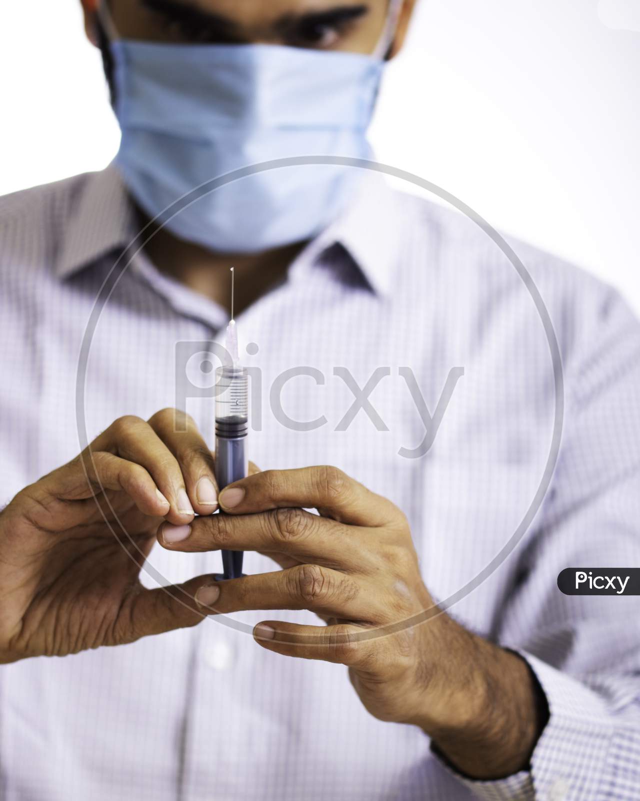 Doctor With Vaccine And Syringe