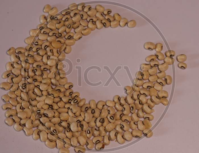Raw Organic Black Eyed Peas Beans Isolated on a White Background