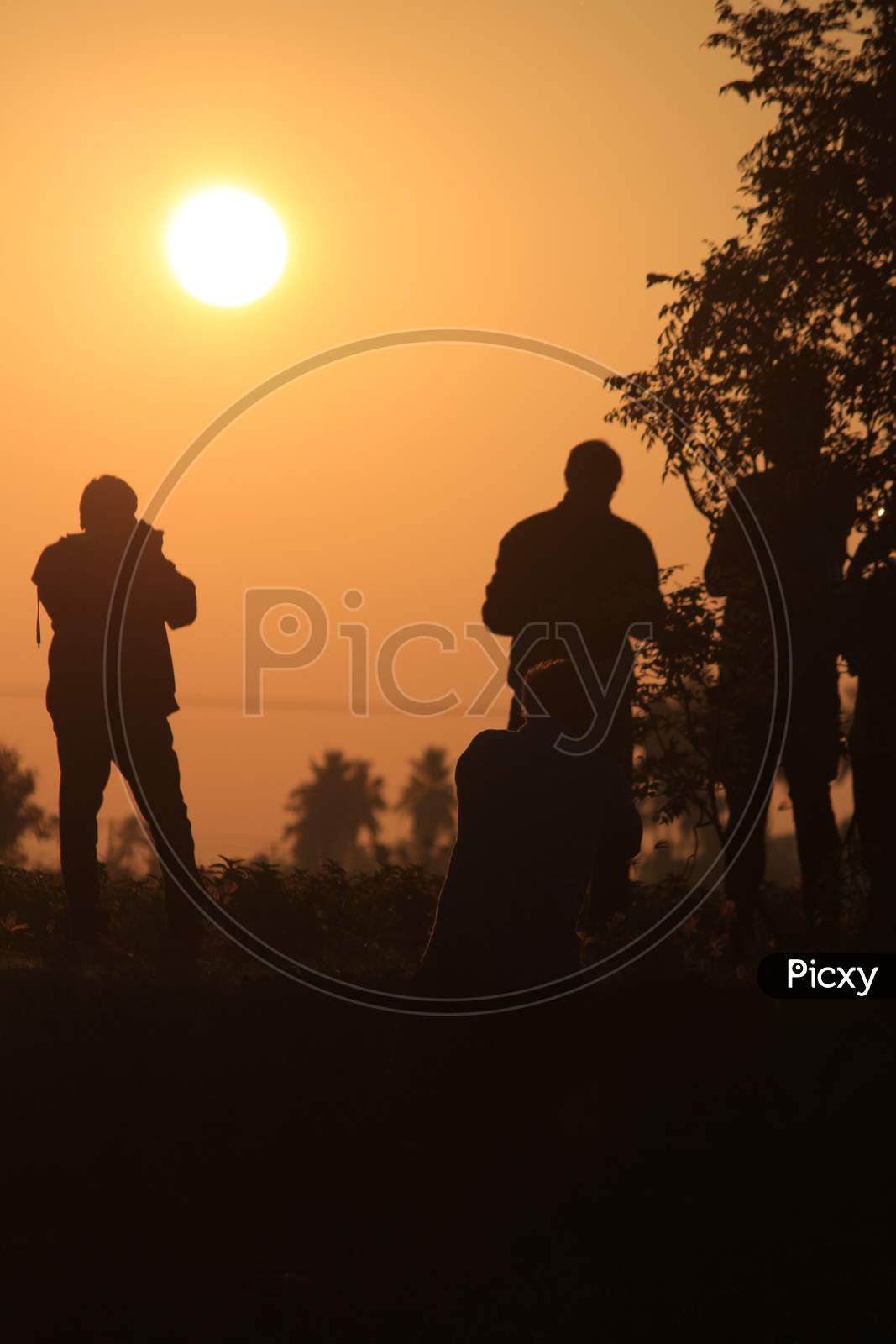 Silhouette Image Of Man Taking Photograph Of The Sunrise. Silhouette Picture Of Man In The Outdoor