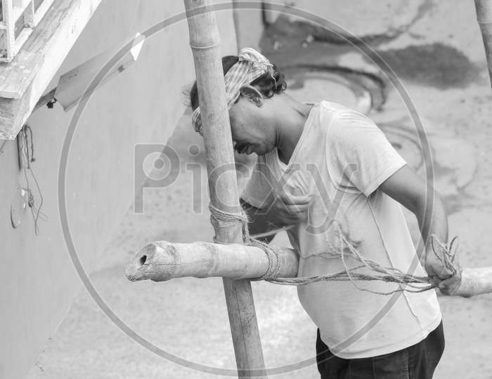 daily wage worker at work in black and white