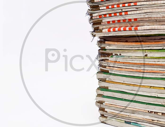 Stack Of Books Isolated On White Background With Copy Space.