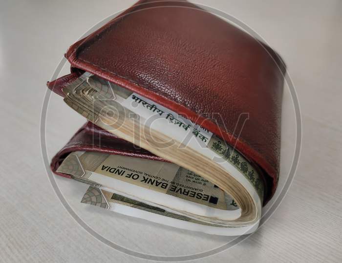 full money-bag with coins on banknotes Stock Photo - Alamy