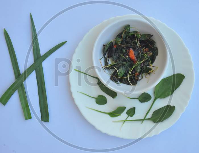 Top view of saag (greens) recipe isolated over white background