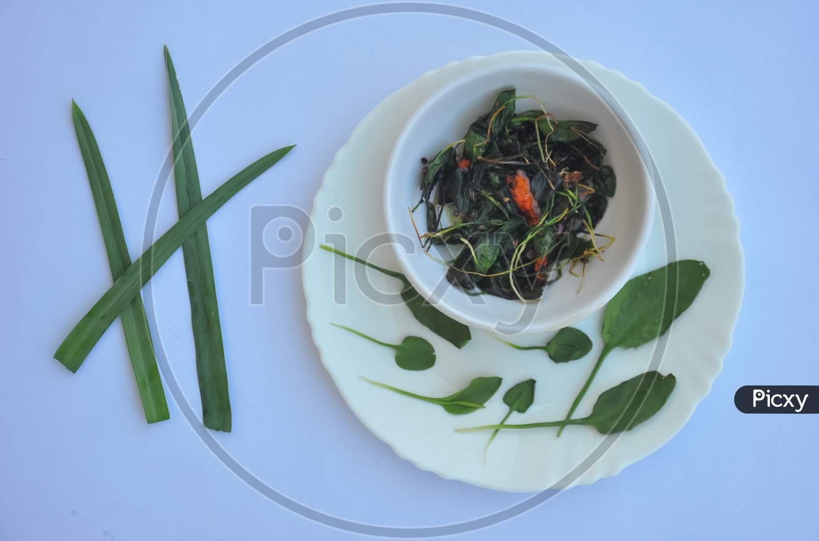 Top view of saag (greens) recipe isolated over white background