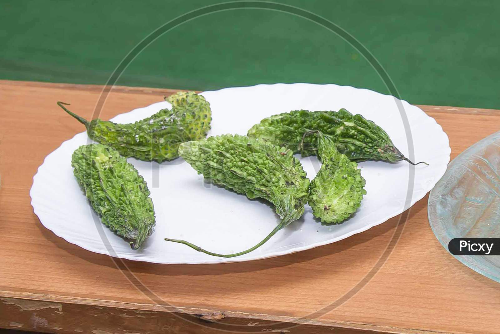 image-of-bitter-melon-or-bitter-gourd-called-karela-in-hindi-on-white