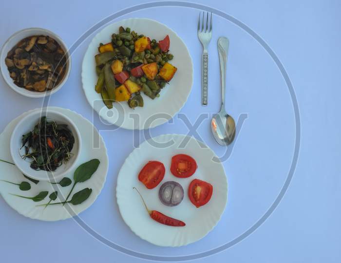 High angle view of variety of Indian food recipe isolated over white background with copy space
