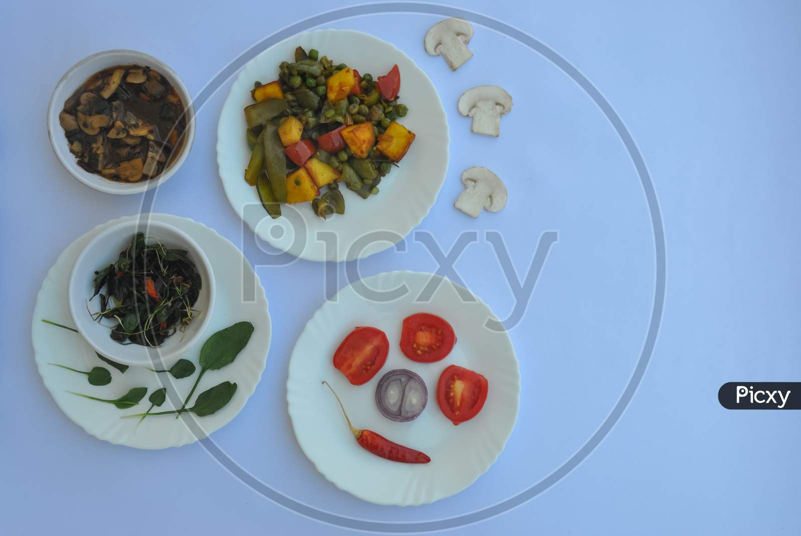 High angle view of variety of Indian food recipe isolated over white background with copy space