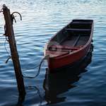 Image of Small Wooden Fisherman Boat Or Transport Moored In The Harbor.  Wooden Boat In Calm Water.-PH050030-Picxy