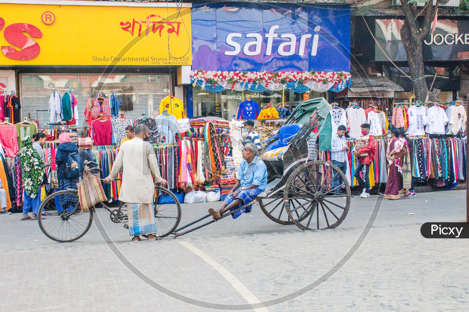 Handpull rickshaw and rickshawman at kolkata west bengal