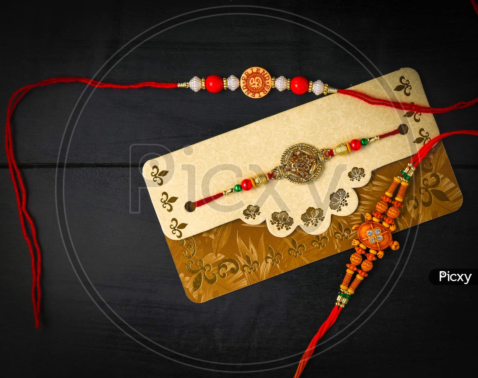 Raksha Bandhan background with an elegant Rakhi. A traditional Indian wrist band which is a symbol of love between Brothers and Sisters