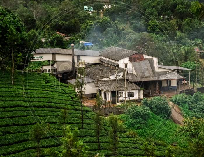 Long Shot Of A Tea Factory In Vythiri Wayanad Kerala Surrounded By Tea Plantations During Monsoon.