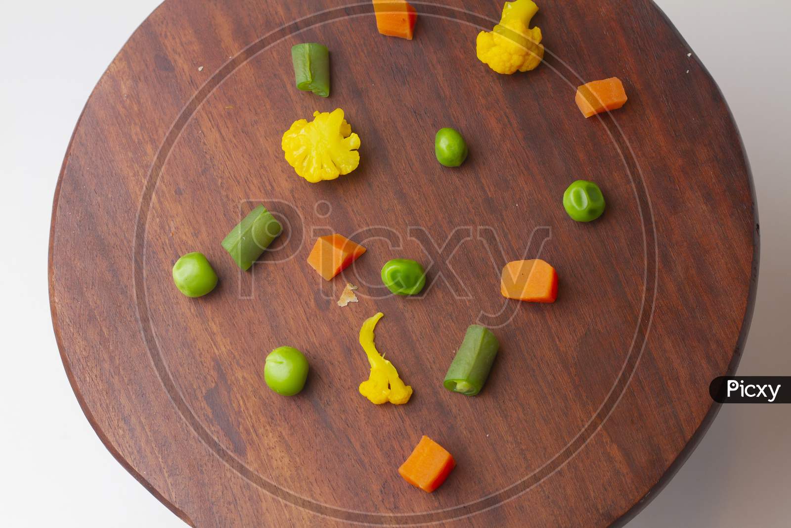 Top Of View Mixed Vegetable Carrot Broccoli And Cauliflower In Bowl On Wooden Background.