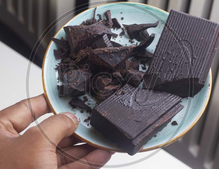 Milk Dark Chocolate Pieces Isolated On Blue Plate From.