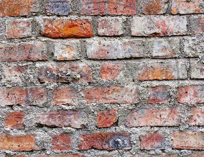 Old brick wall, intact background photo texture.  Wit wall background