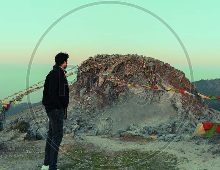 man standing near a mountain