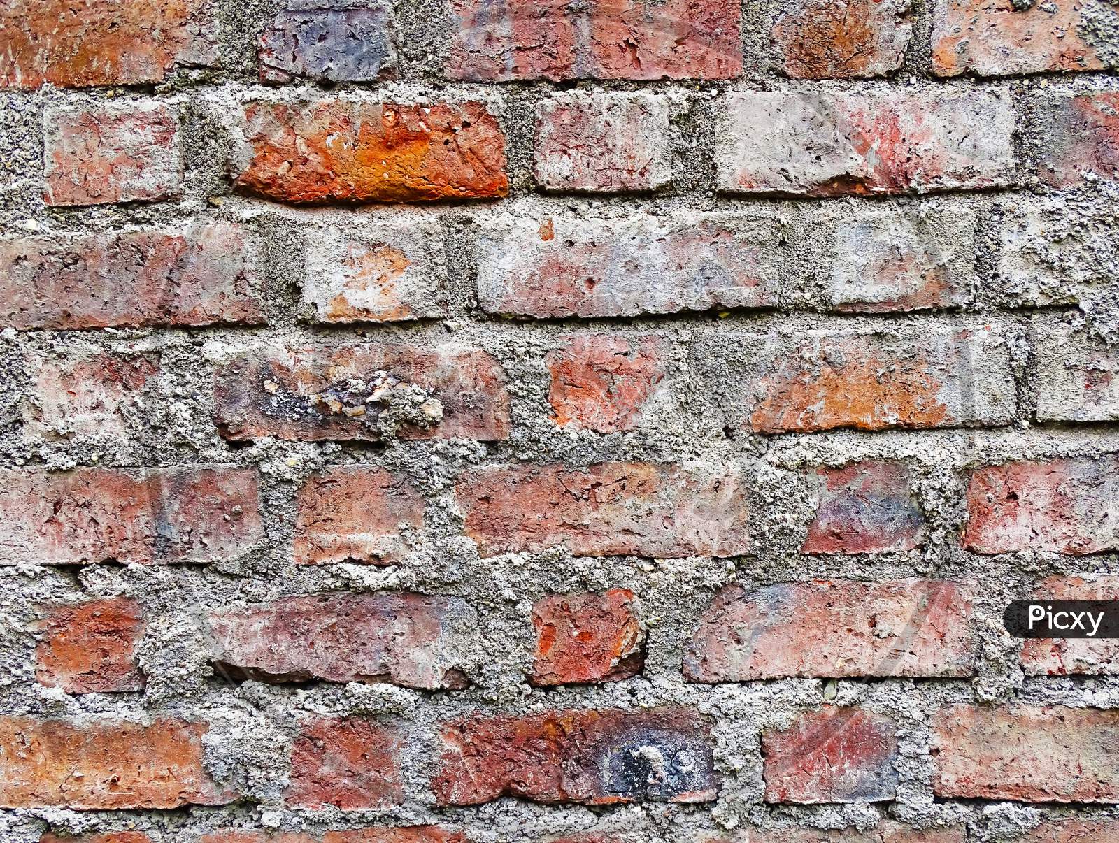 Old brick wall, intact background photo texture.  Wit wall background