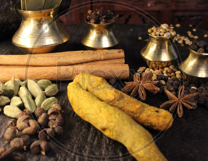 Most common and flavourful Indian Spices. Spices used in Indian food. Spices in traditional masala grinding stone