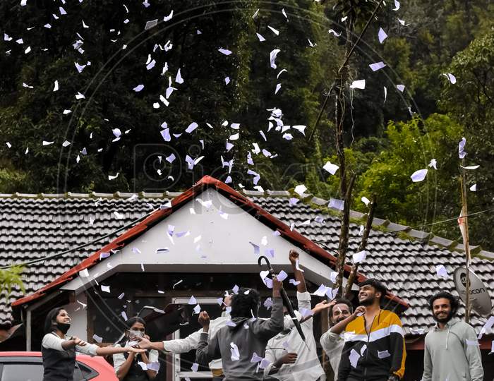 Vythiri, Kerala - July 15, 2021: A Group Of College Students Celebrating Their Farewell By Throwing Cofetti Like Paper Bits. Graduation And Say Goodbye To College Life.