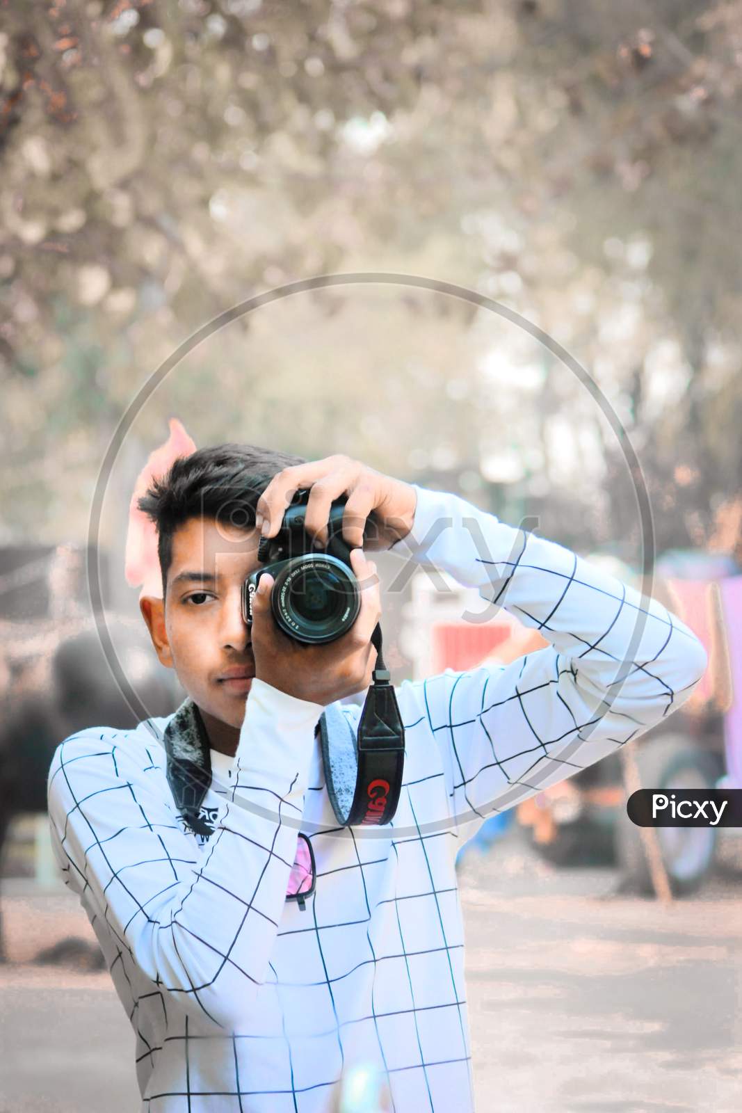 Man posing with camera  PixaHive