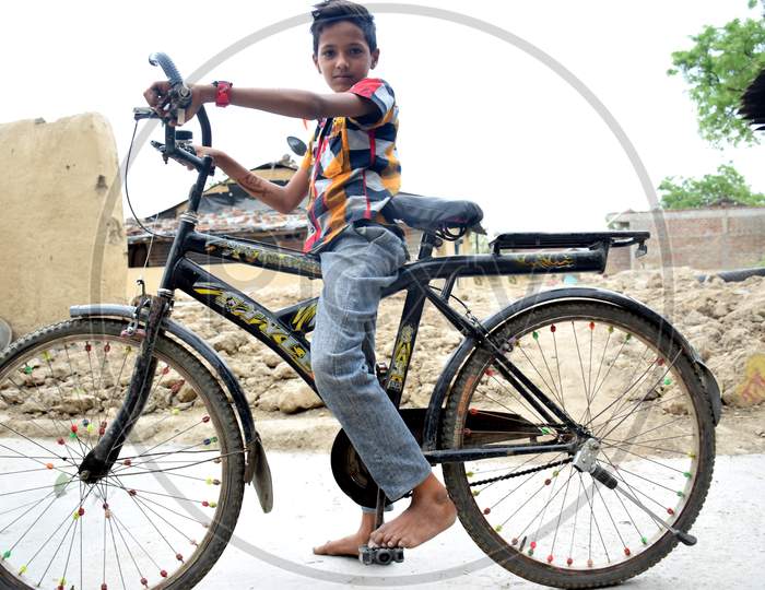 The Indian Rural Child Is Blissful With His Bicycle