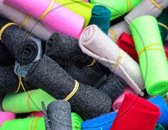 Detailed Close Up View On Samples Of Cloth And Fabrics In Different Colors Found At A Fabrics Market