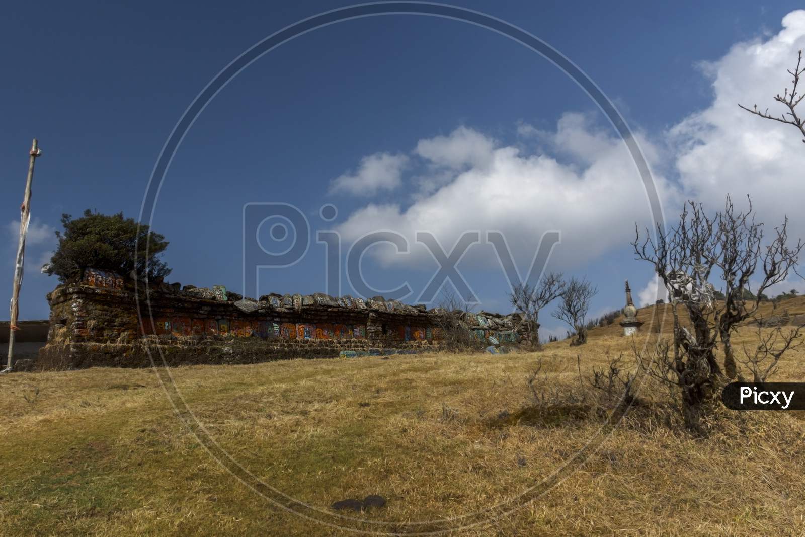 A Ruin Of A Monastery At Chitre Near Darjeeling With Blue Sky And White Clouds. Selective Focus.