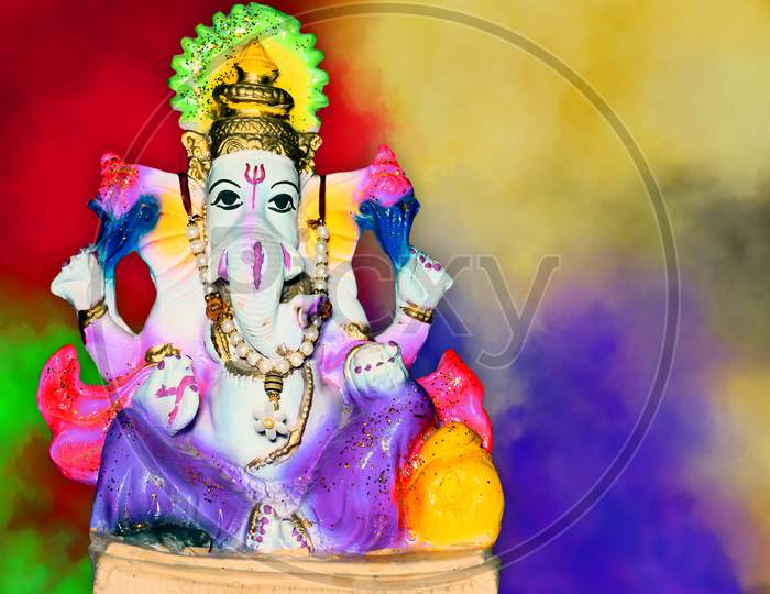 The Lord Of Ganesha. Lord Ganesha On Colorful Background, Hindu God Ganesha. Ganesha Colorful Idol. Indian Culture