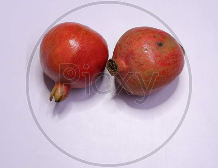 Fresh Pomegranate Fruits Isolated on White Background