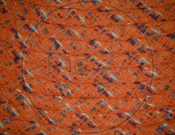 Orange Color Cloth Texture With Mixed Design Pattern.