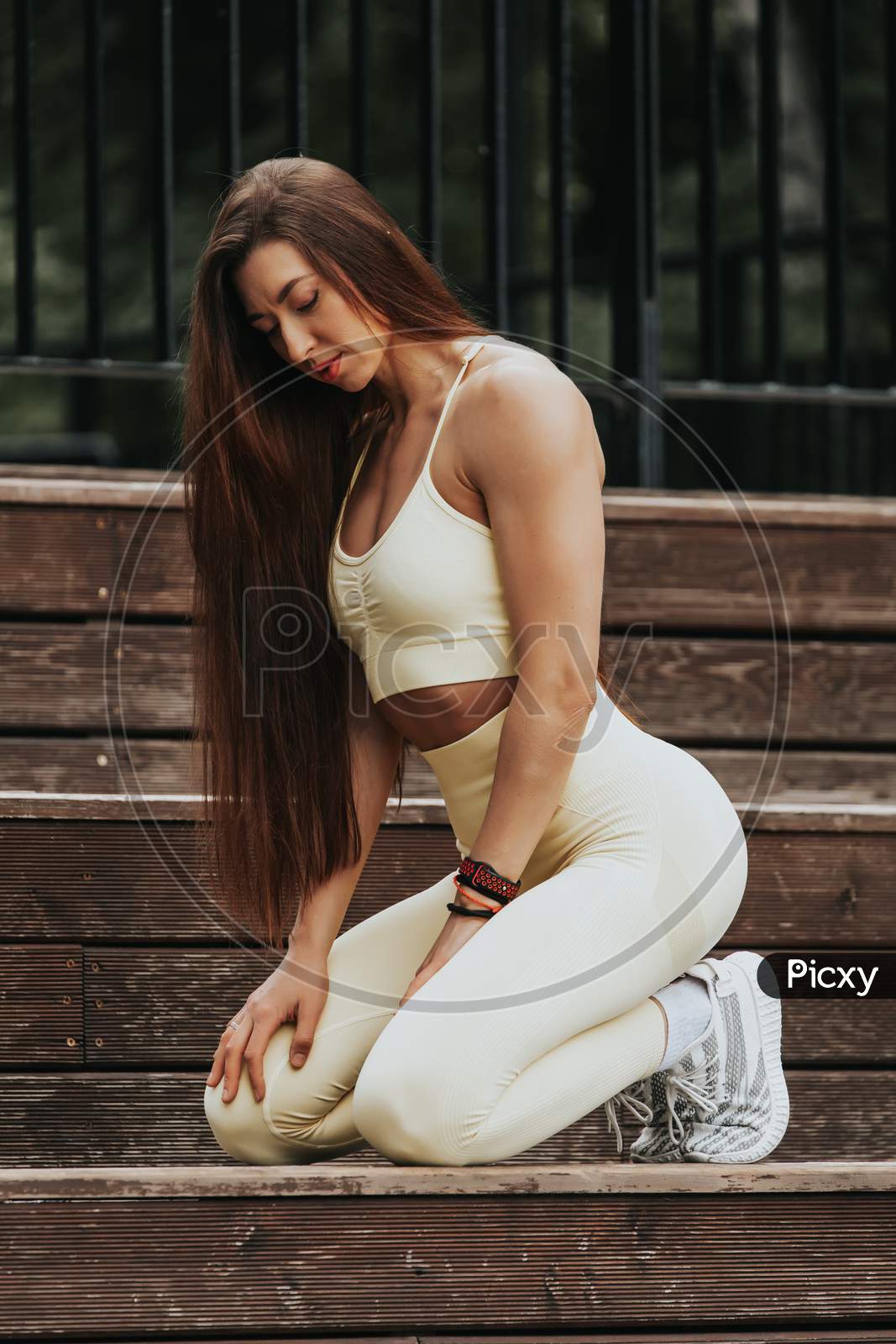 Attractive Young Woman In Sportswear Posing. Sensual Brunette Woman With Perfect Body. Sport Activity Lifestyle Concept