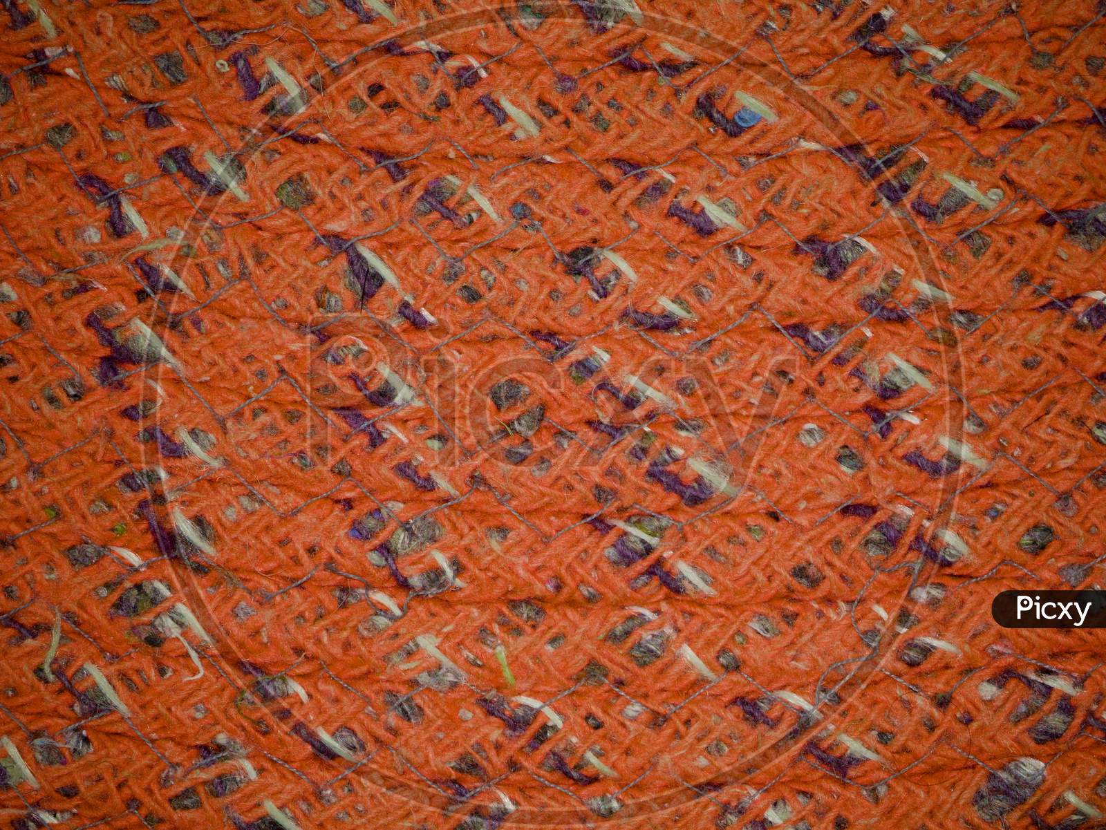 Orange Color Cloth Texture With Mixed Design Pattern.