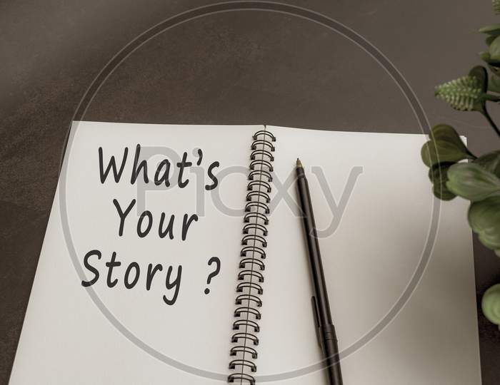 What Is Your Story Text On Notebook With Dark Background