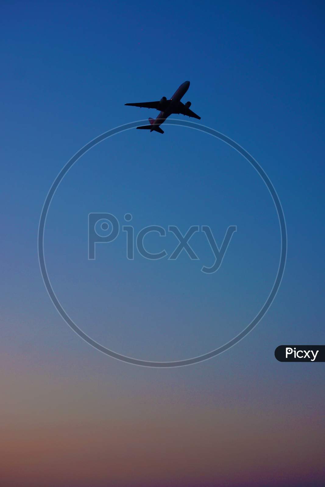 Airplane Silhouette And Sky Image