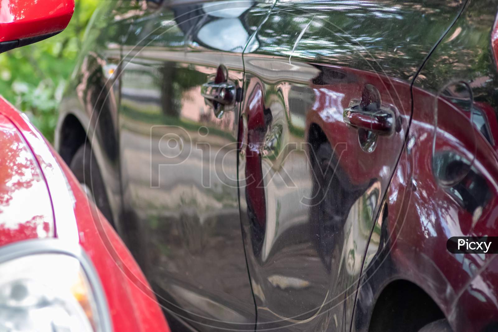 Crashed and dented car door is totally demolished after a heavy car accident with a write-off for the car insurance or repair needs with hit-and-run after collision for car insurance in traffic injury