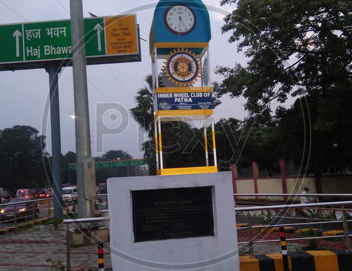 Monument with clock stand