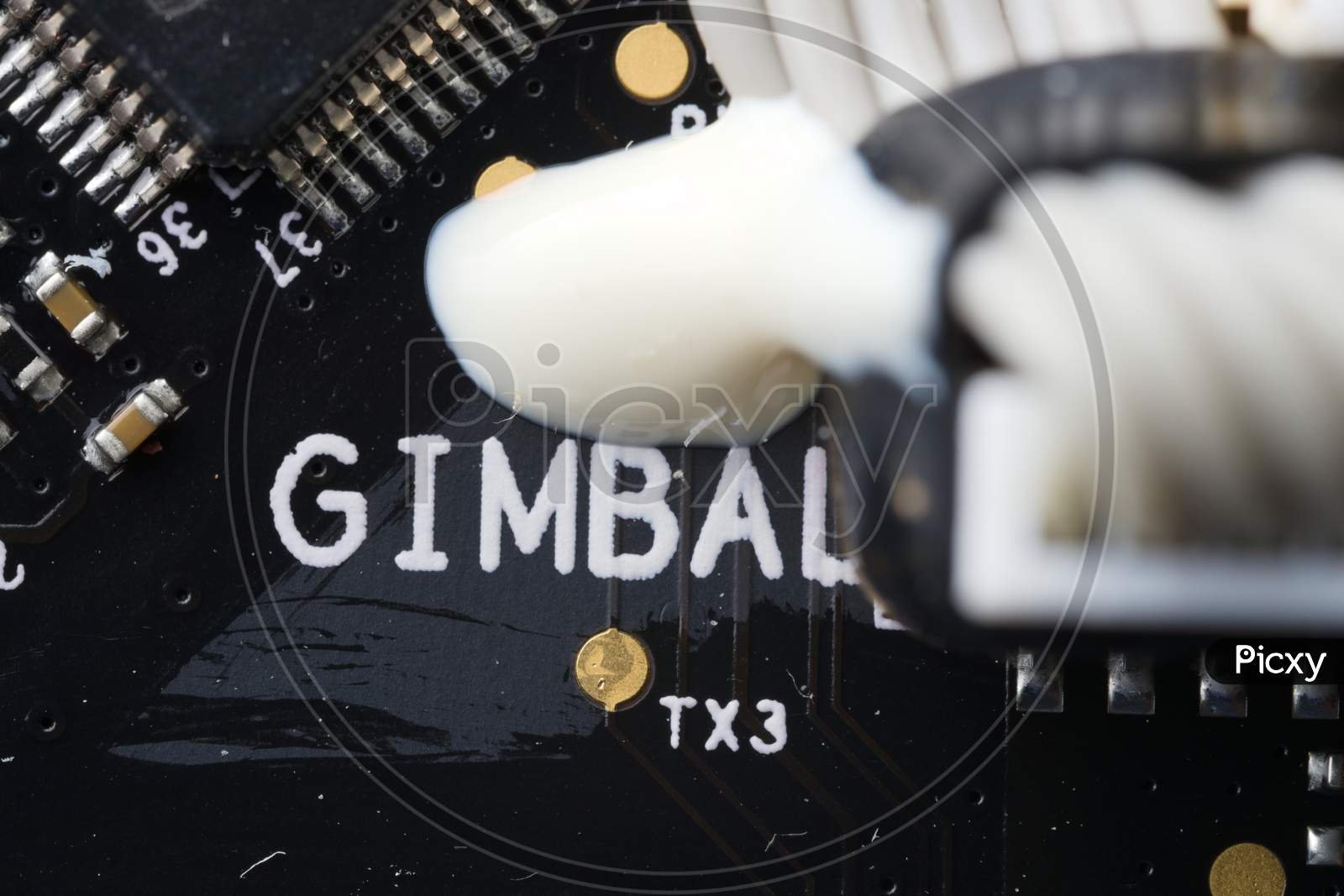 Close Up Of Drone Circuit Board, Showing Gimbal Area And Components