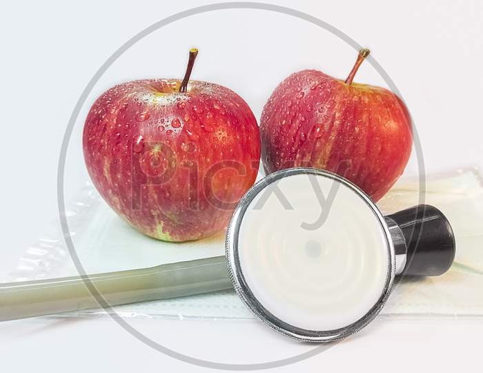 Two Apples And A Stethoscope .Healthy Eating For Good Health.