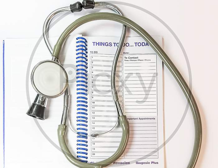 Stethoscope And Planner On The Doctor'S Table.