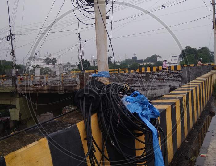 Electric pole and wire on flyover wall