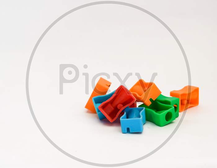 Multiple Color Pencil Sharpeners Isolated On White Background With Copy Space.