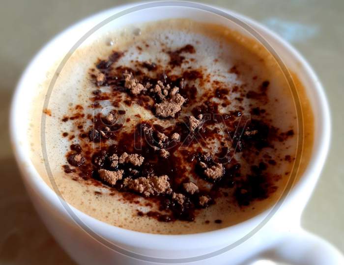 Picture of a close-up of freshly prepared coffee, ready to drink.