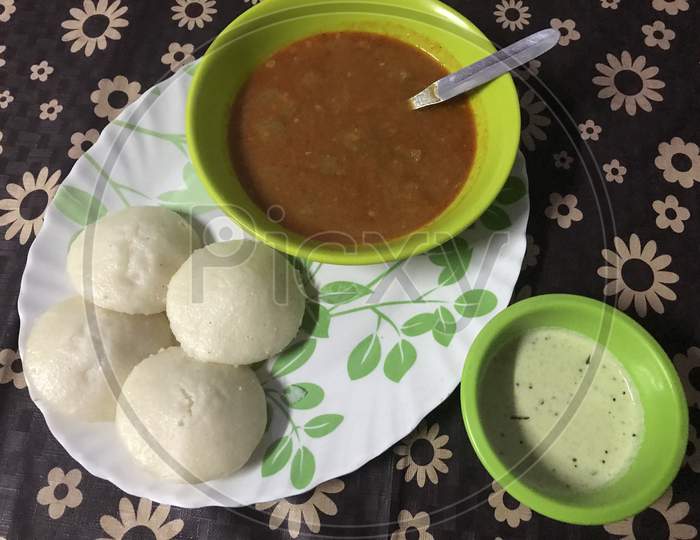 A picture of a freshly prepared breakfast, Idli Sambhar, which is a popular Indian Snack.