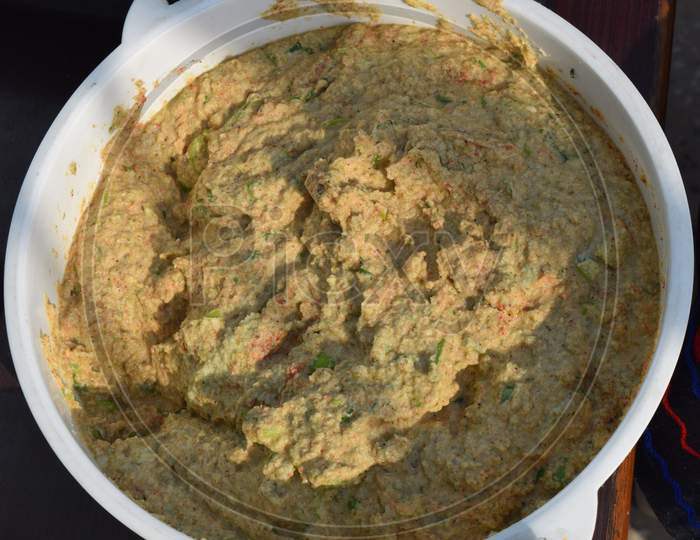 A picture of a freshly prepared batter, to use to prepare the meal like pakoda, curry.