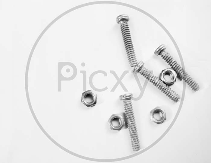 close up picture of nut and screw on white background.