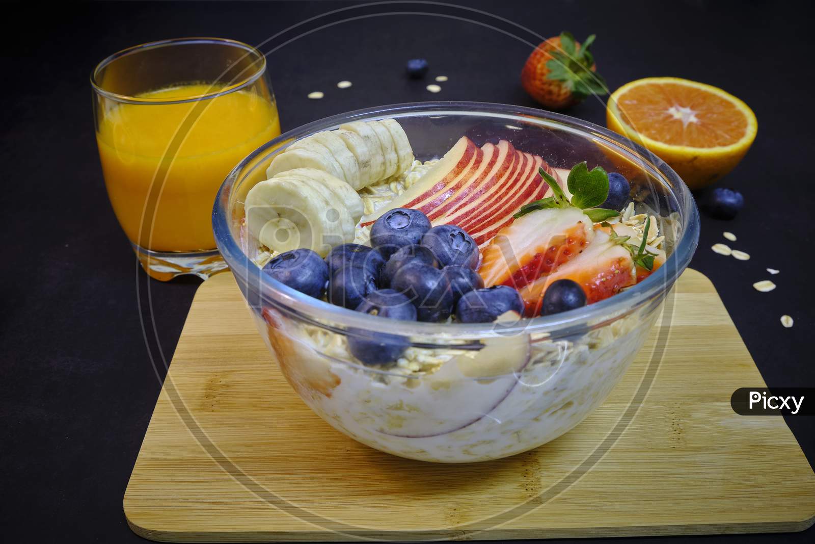 Healthy Breakfast With Fresh Fruits. Bowl Of Colorful Fruits And Oats.
