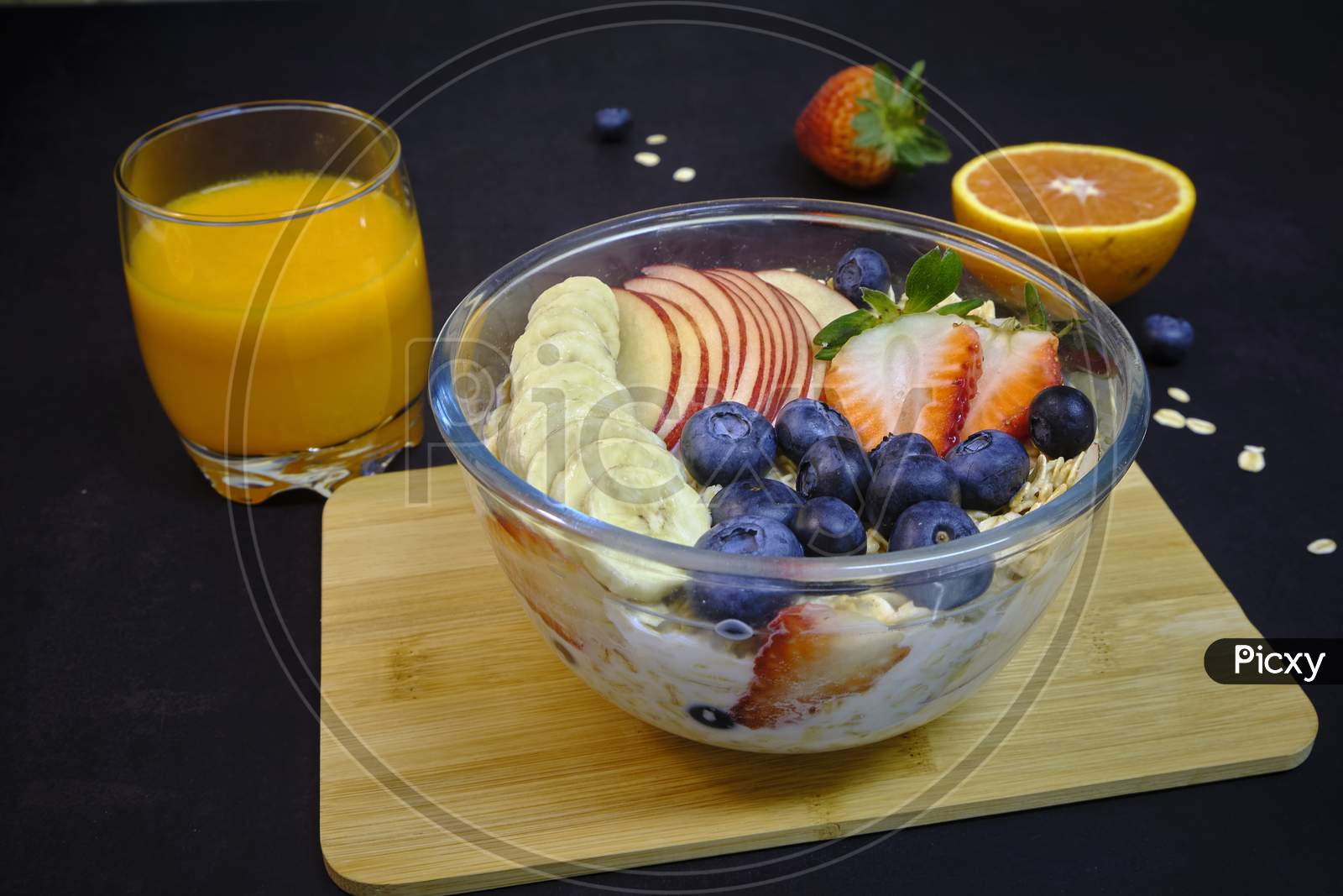 Healthy Breakfast With Fresh Fruit Cocktails. Bowl Of Colorful Fruits And Oats.