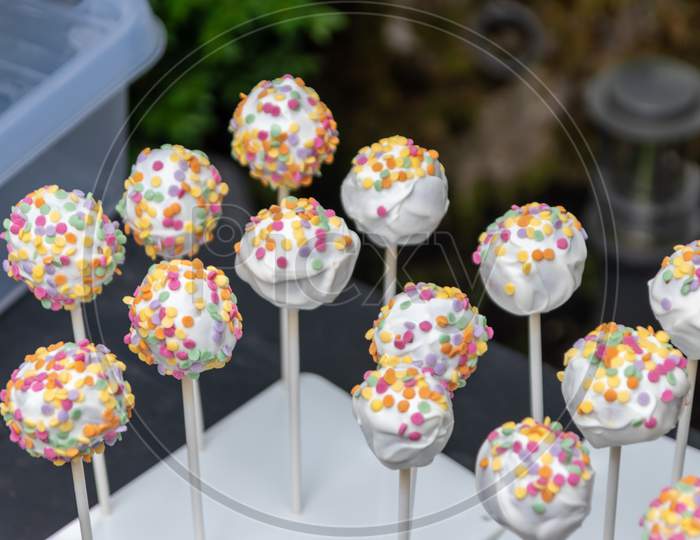 Tasty cookie lolly with colorful sugar sprinkles as delicious snack and party catering on birthday party or as yummy decoration for kids and children and idea for cakes and cookies with sugar topping