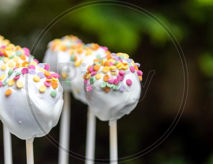 Tasty cookie lolly with colorful sugar sprinkles as delicious snack and party catering on birthday party or as yummy decoration for kids and children and idea for cakes and cookies with sugar topping